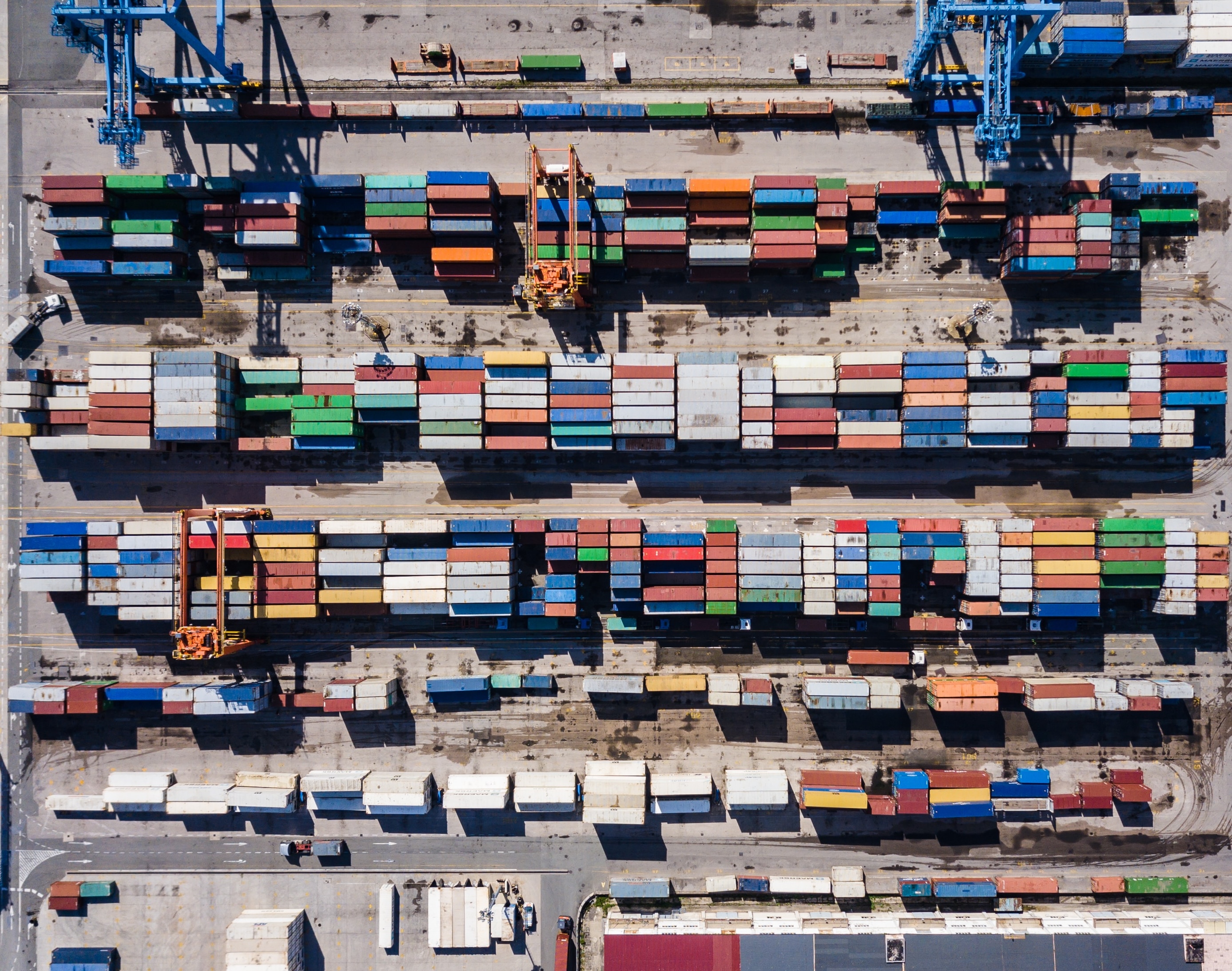 boxes lined up in a port for transportation 