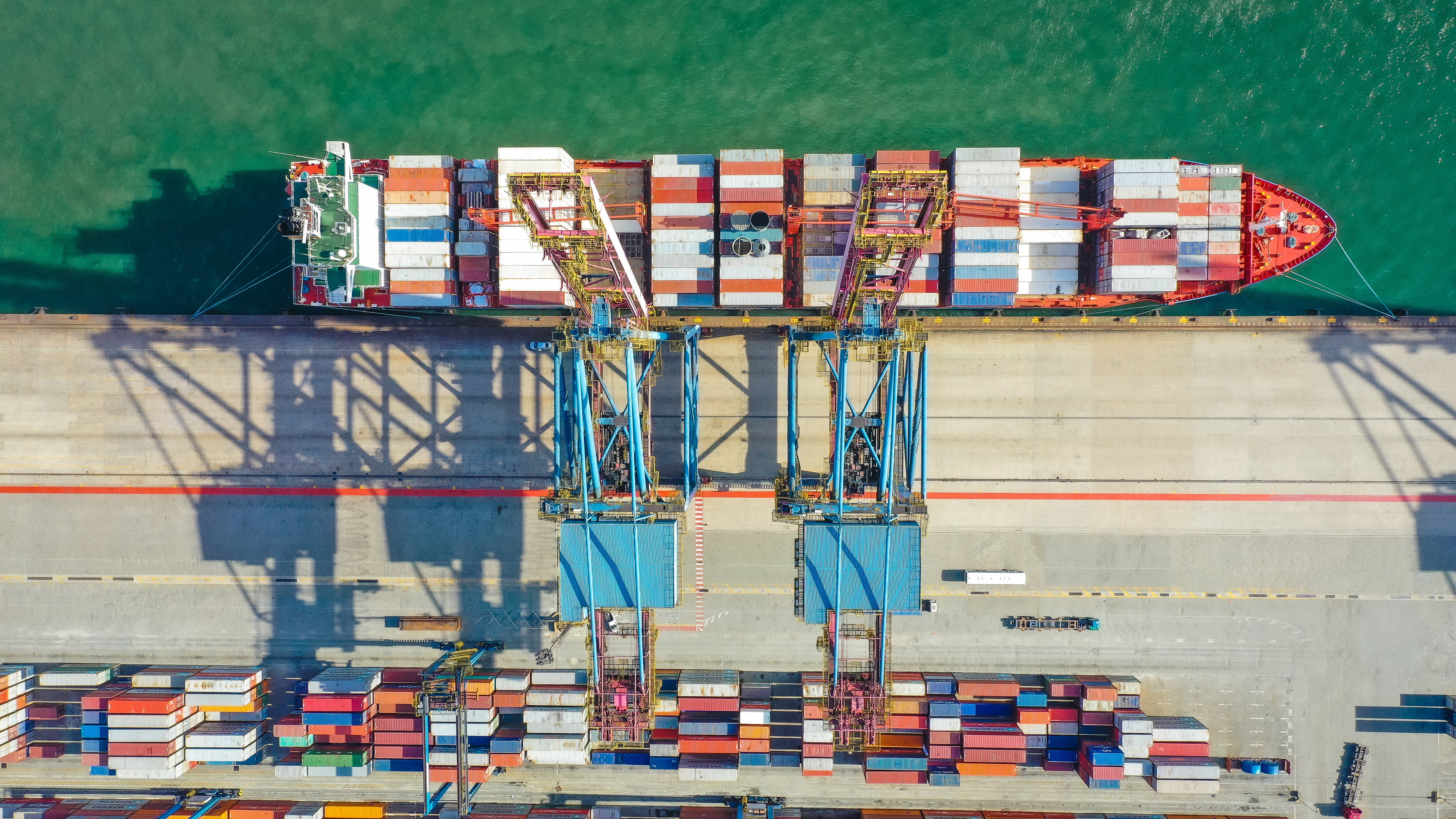 containers loaded onto a ship in a harbor