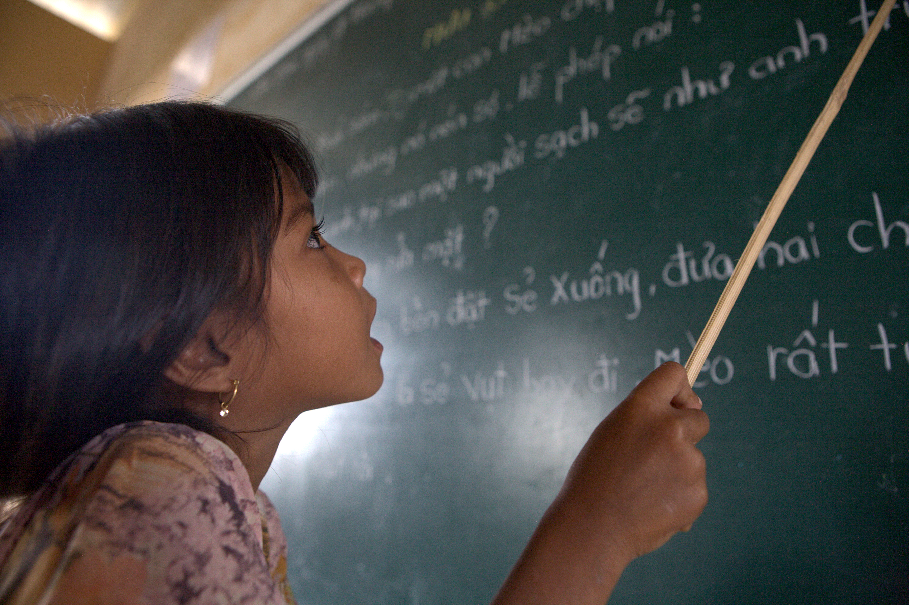 Young girl at a chalkboard