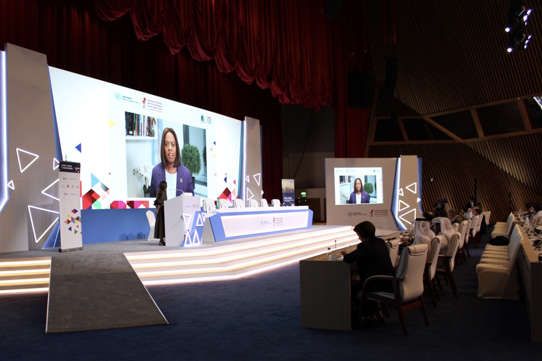 Sanda Ojiambo on a screen at COSP11