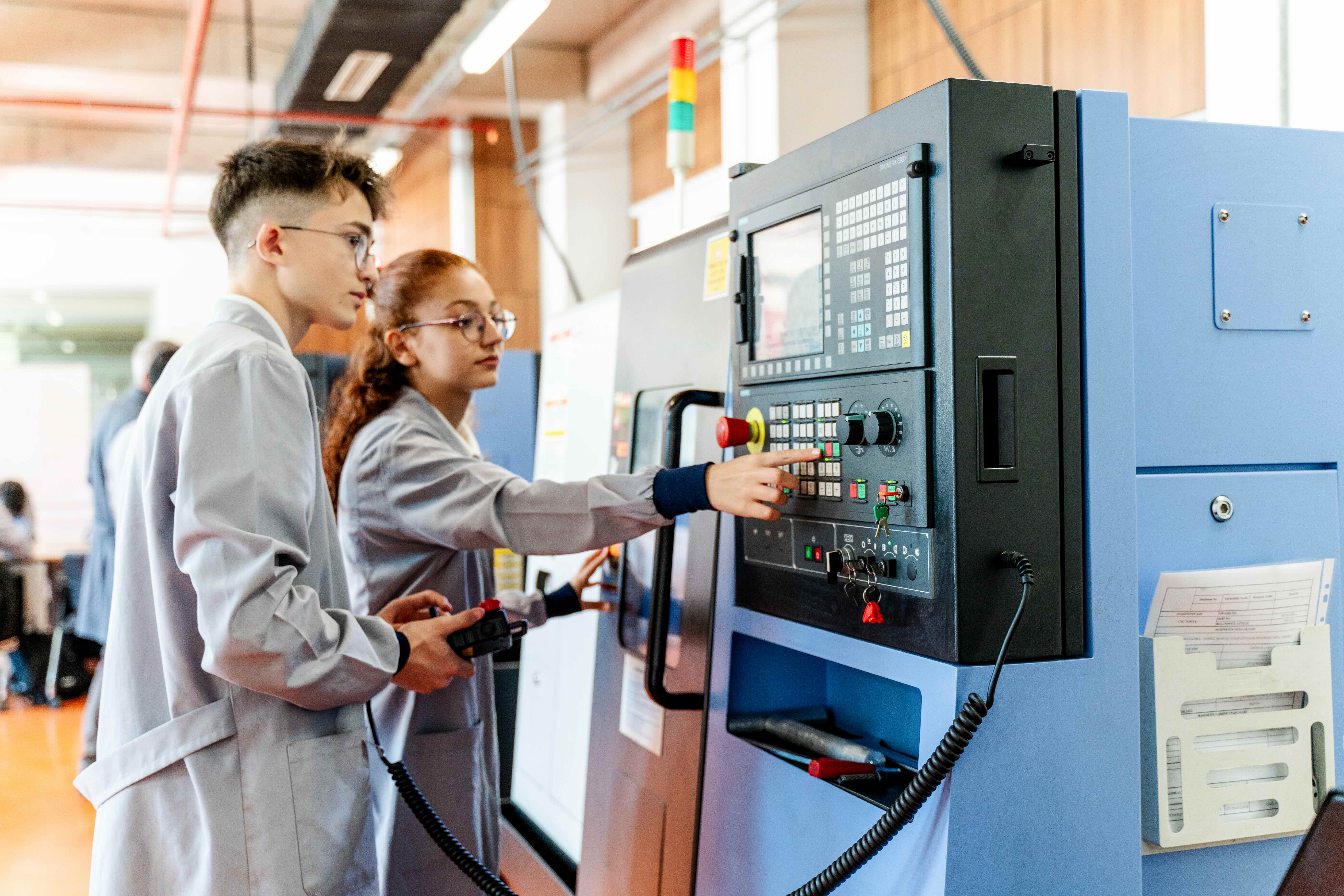 people working on a machine 