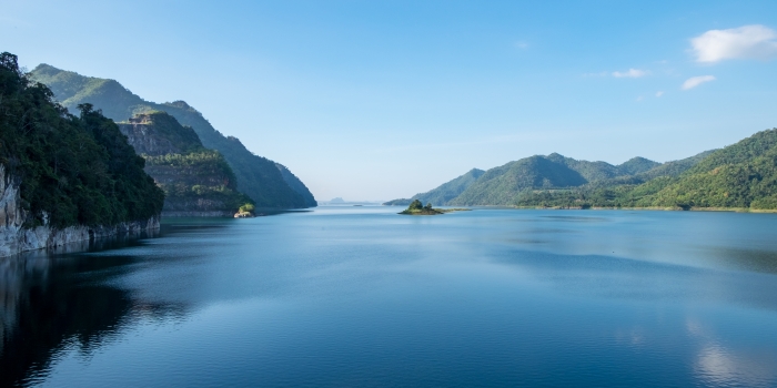 blue lake with mountains on the side