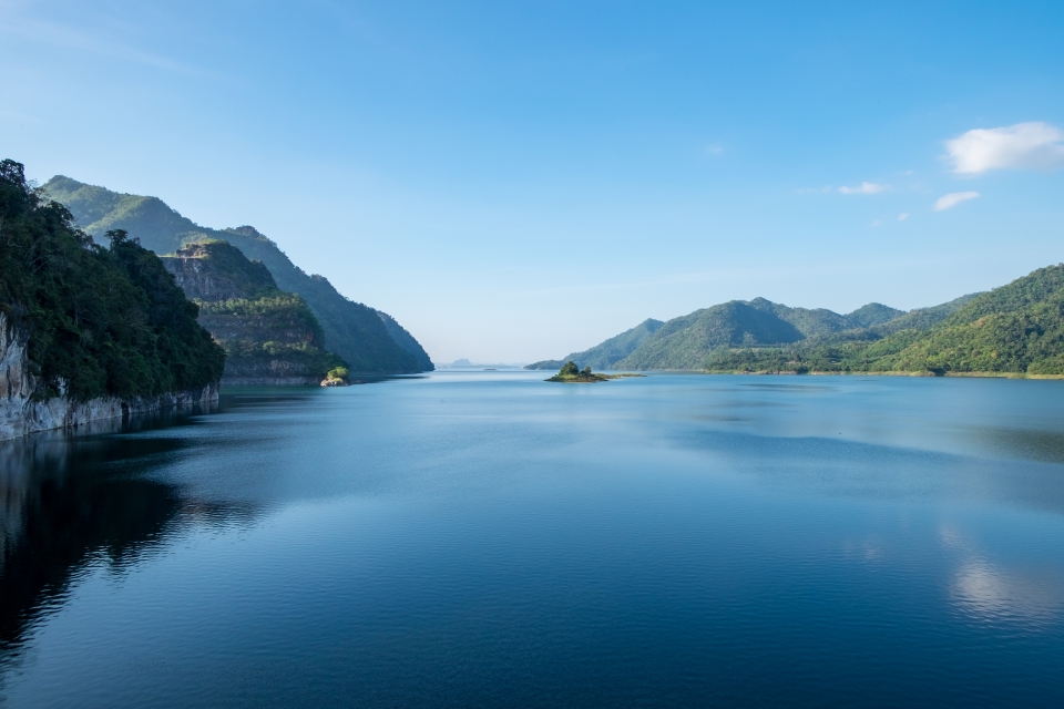 blue lake with mountains on the side