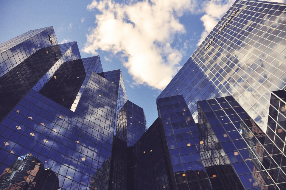 building with the sky's reflection in its windows