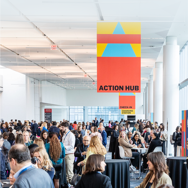 Cover Image for the Leaders Summit Event. Groups of people socialising in lobby
