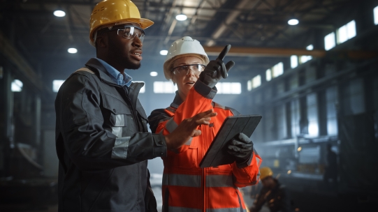 Two workers in conversation 