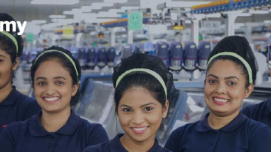 5 women standing and smiling