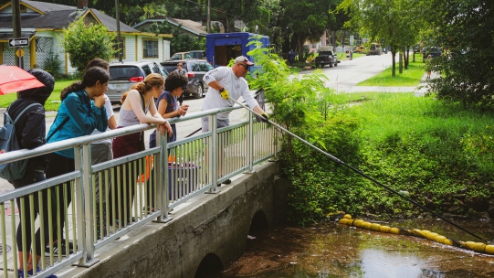 People cleaning a river